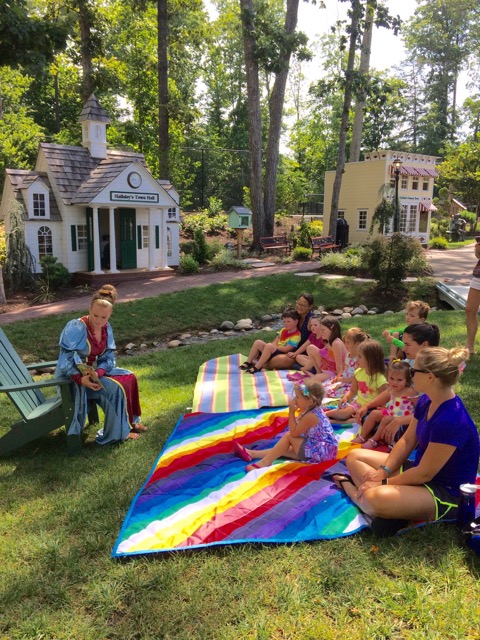 Reading Stories To Children In The Park