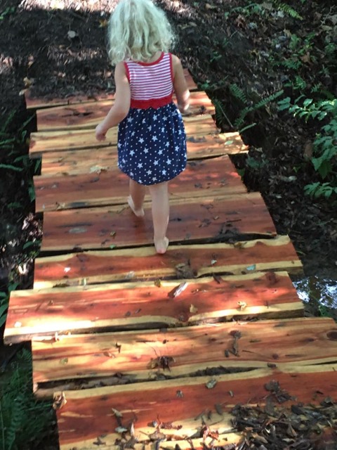Girl On Wood Path On Trail