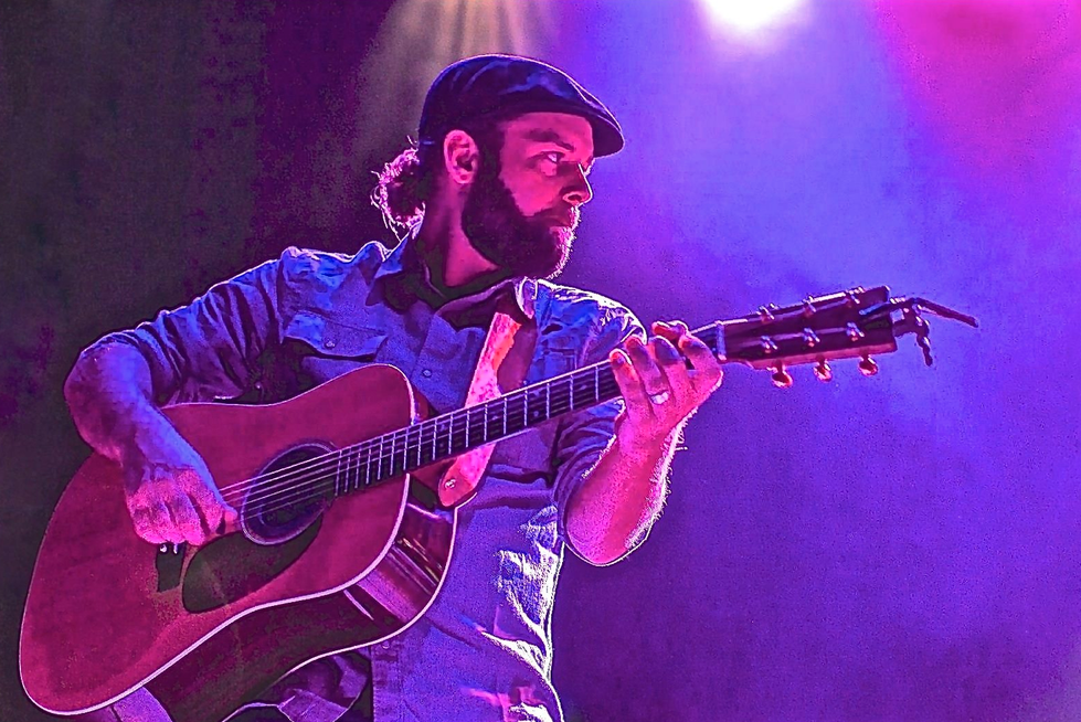 Main Playing Guitar on Stage