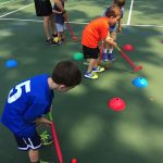 Little Kids playing Golf