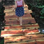 Girl On Wood Path On Trail